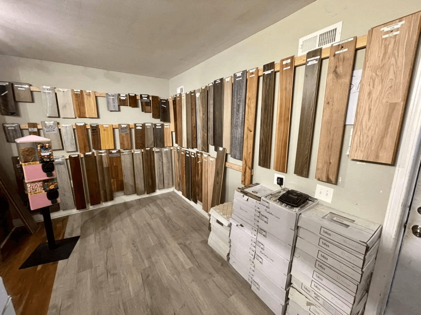 Flooring showroom sample wall with tile and plank options